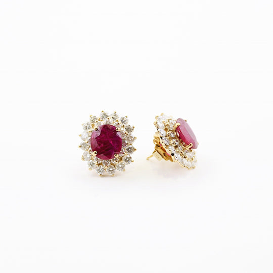 JewelCreationsNY earrings featuring elegant gold hoops with intricate gemstone detailing for a stylish accessory.