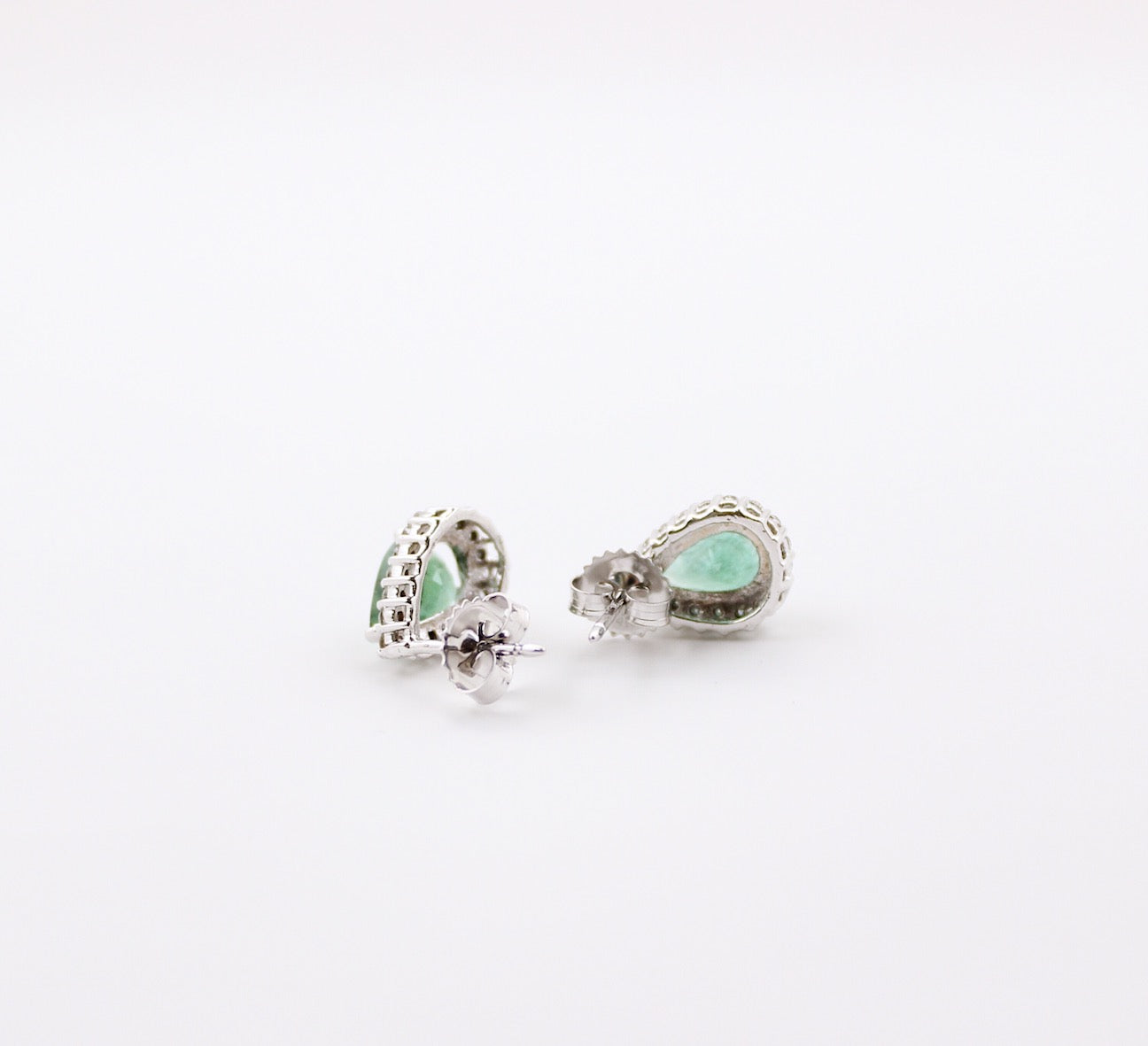 JewelCreationsNY earrings featuring elegant silver hoops with intricate gemstone accents, showcased on a white background.