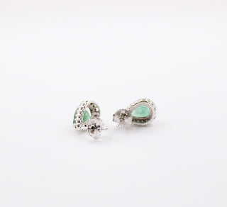 JewelCreationsNY earrings featuring elegant silver hoops with intricate gemstone accents, showcased on a white background.