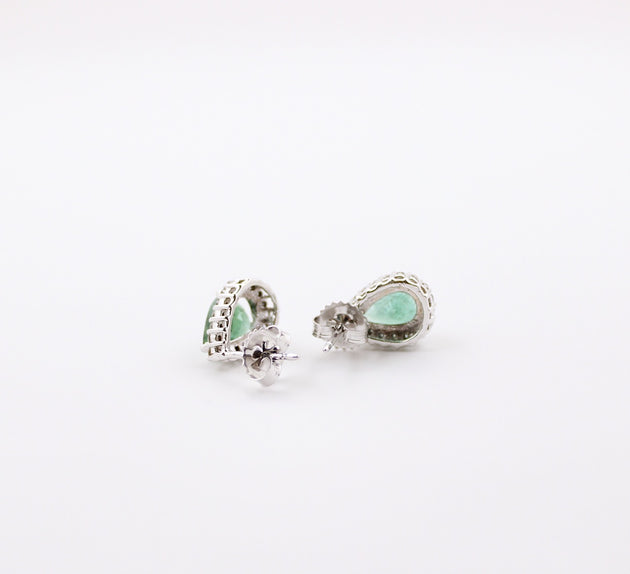 JewelCreationsNY earrings featuring elegant silver hoops with intricate gemstone accents, showcased on a white background.