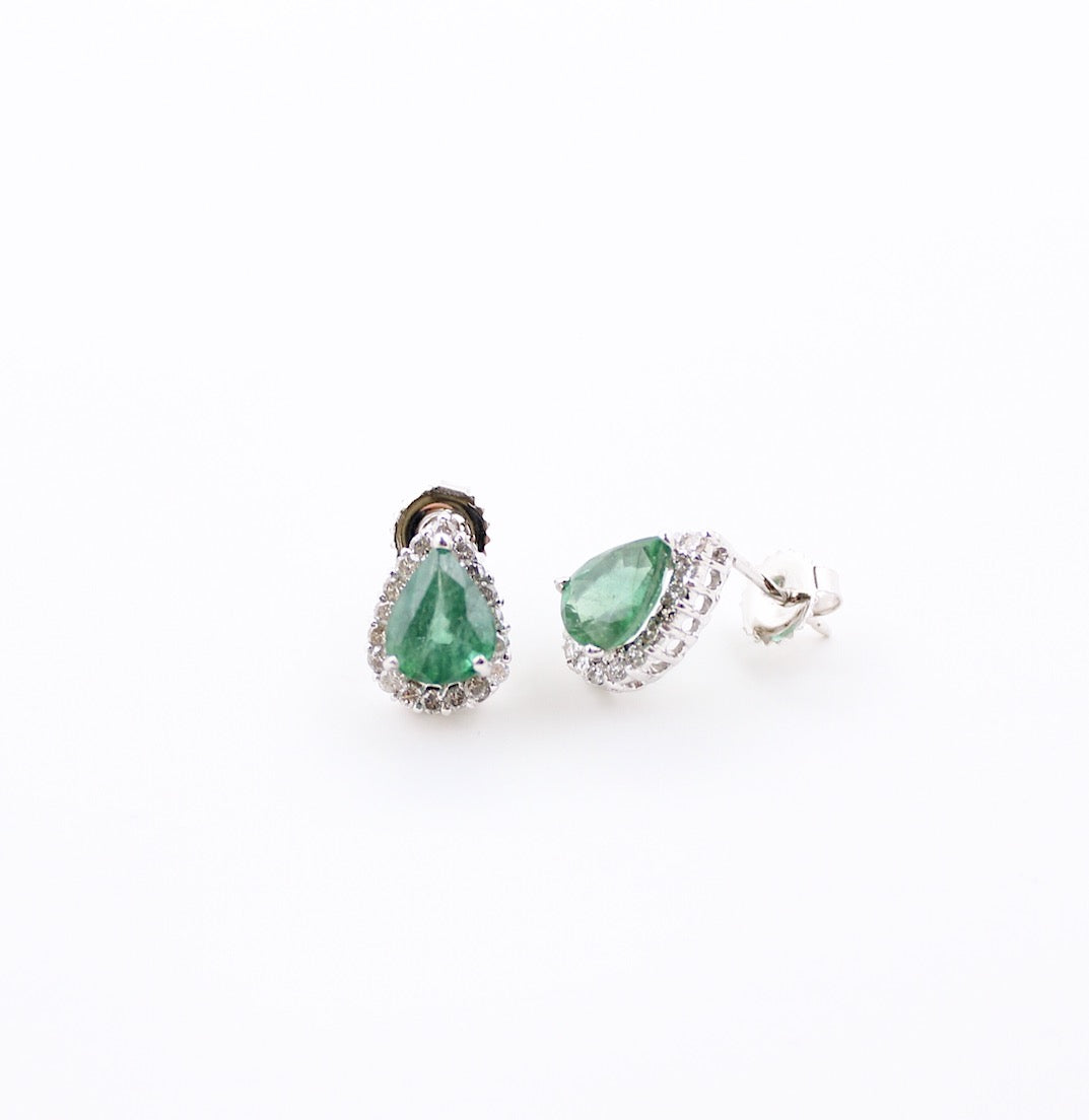 JewelCreationsNY earrings featuring elegant silver hoops with intricate gemstone detailing, displayed on a neutral background.