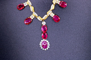 Close-up of a Ruby and Diamond Necklace by JewelCreationsNY showcasing vibrant rubies and sparkling diamonds on a delicate chain.