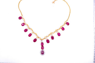 Elegant Ruby and Diamond Necklace by JewelCreationsNY featuring a delicate gold chain with sparkling gemstones.