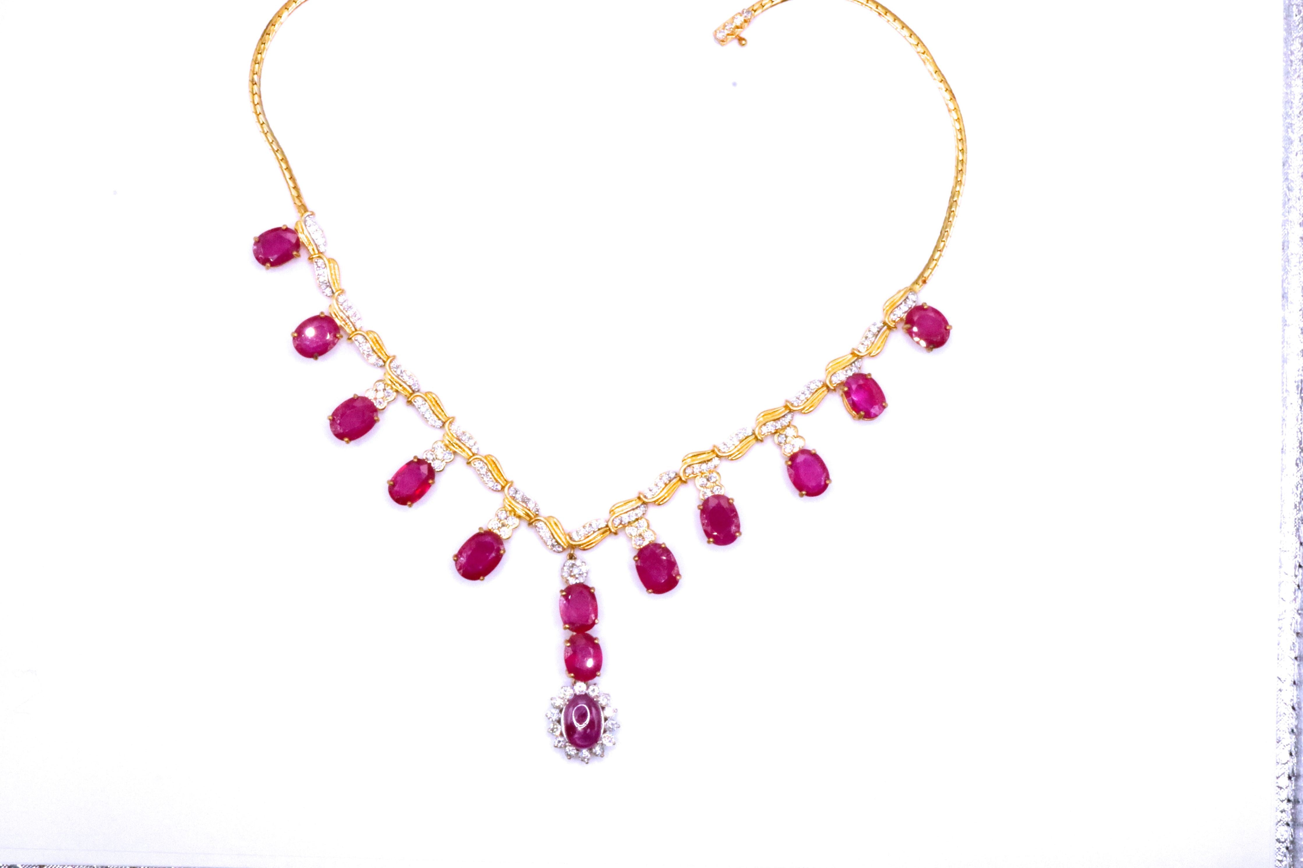 Elegant Ruby and Diamond Necklace by JewelCreationsNY featuring a delicate gold chain with sparkling gemstones.