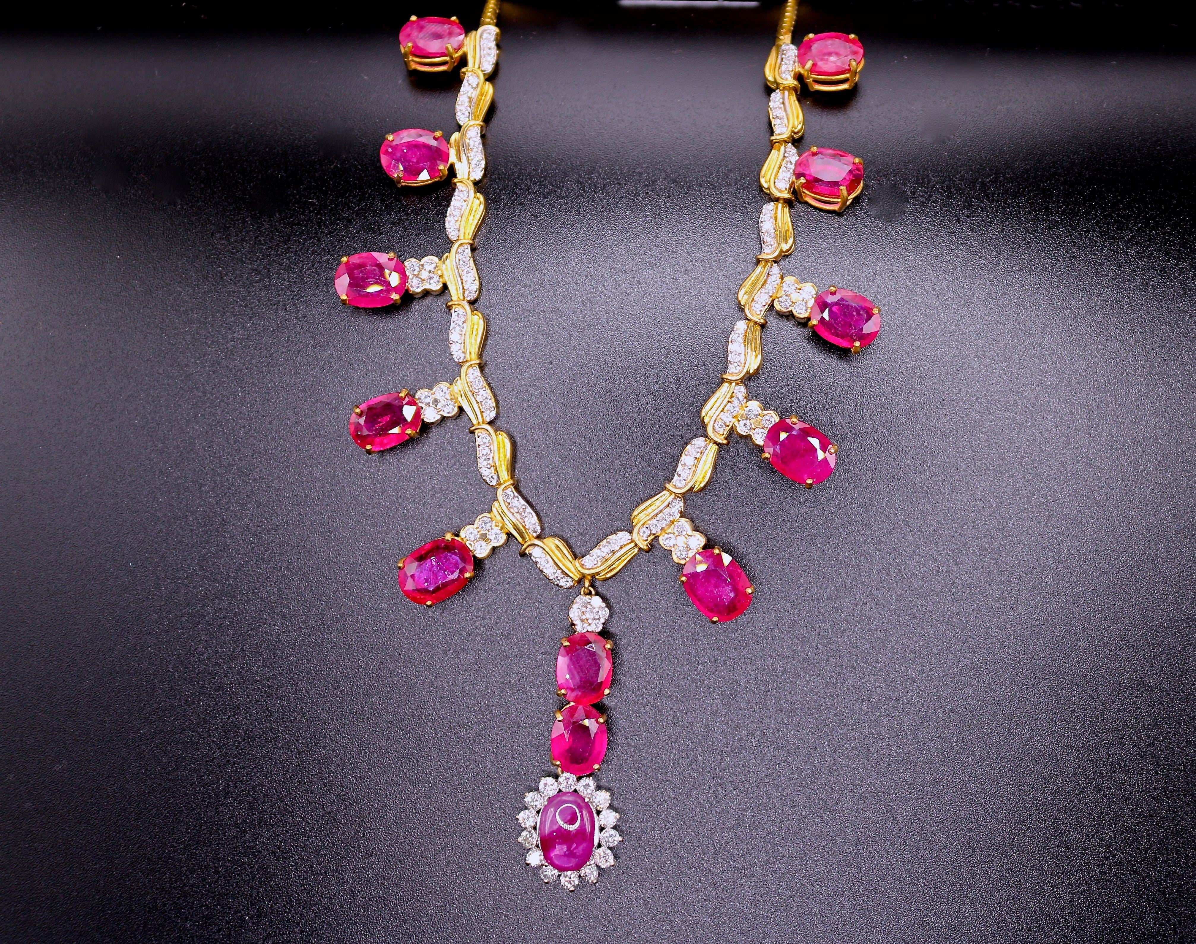 Ruby and diamond necklace by JewelCreationsNY featuring a delicate gold chain with a pendant of vibrant rubies and sparkling diamonds.